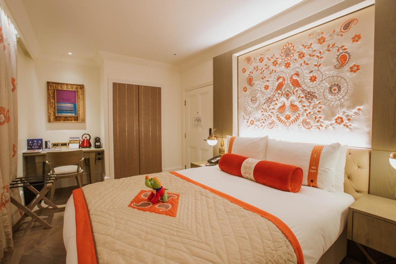 The Lalit London Hotel Exterior foto A bedroom at The Taj Mahal Palace, Mumbai